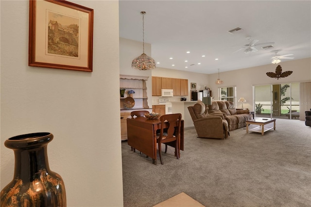 living room featuring carpet flooring, french doors, and ceiling fan