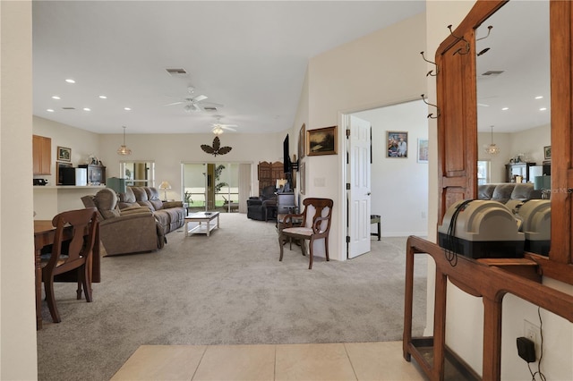 carpeted living room featuring ceiling fan