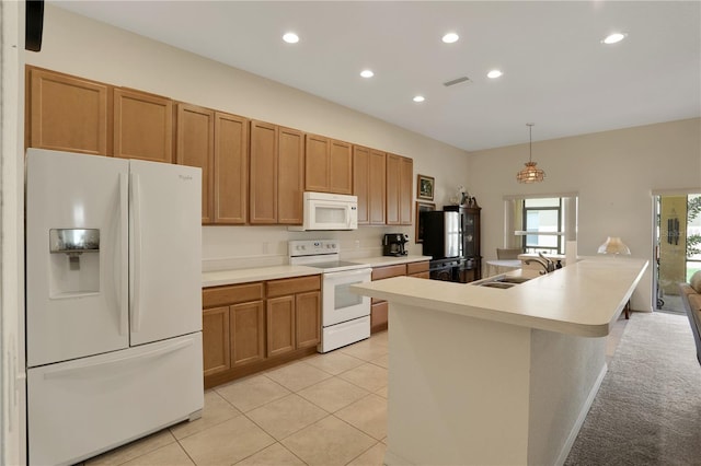 kitchen with pendant lighting, white appliances, sink, light tile patterned floors, and an island with sink