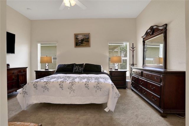 bedroom with ceiling fan and light colored carpet