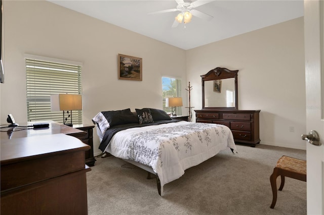 bedroom featuring ceiling fan and light colored carpet