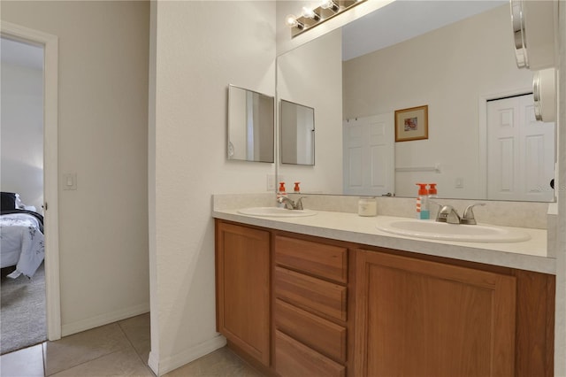 bathroom with tile patterned flooring and vanity