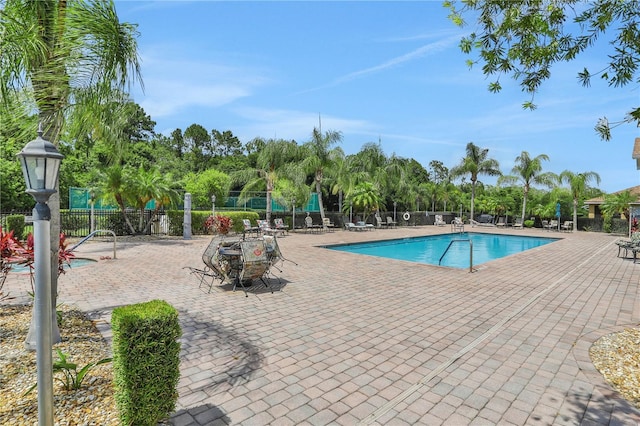 view of swimming pool with a patio