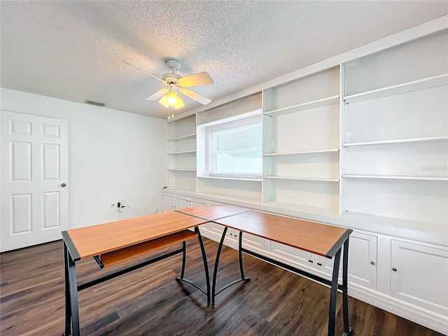 office with ceiling fan, dark wood-type flooring, and a textured ceiling