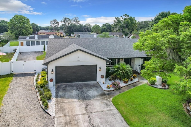 single story home with a front lawn and a garage