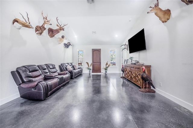 living room featuring lofted ceiling