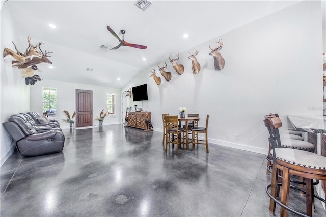 dining area with vaulted ceiling and ceiling fan