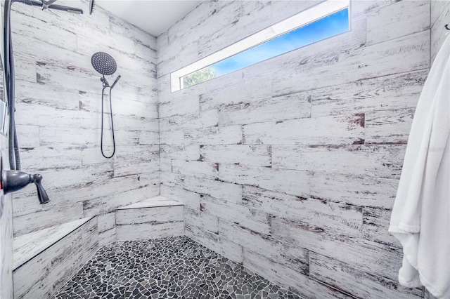 bathroom featuring a tile shower