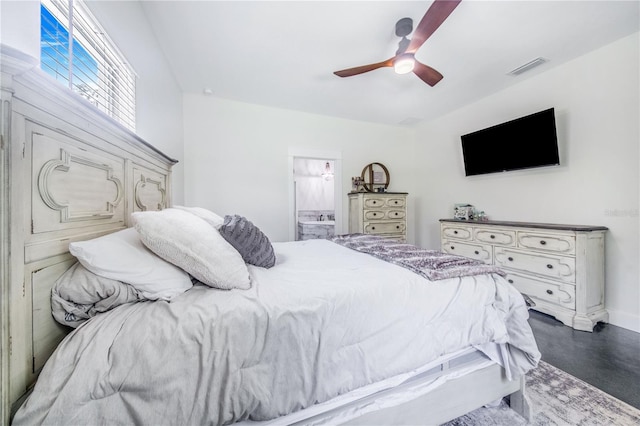 bedroom with ceiling fan and connected bathroom