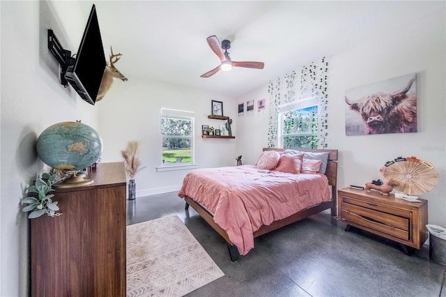 bedroom with multiple windows and ceiling fan