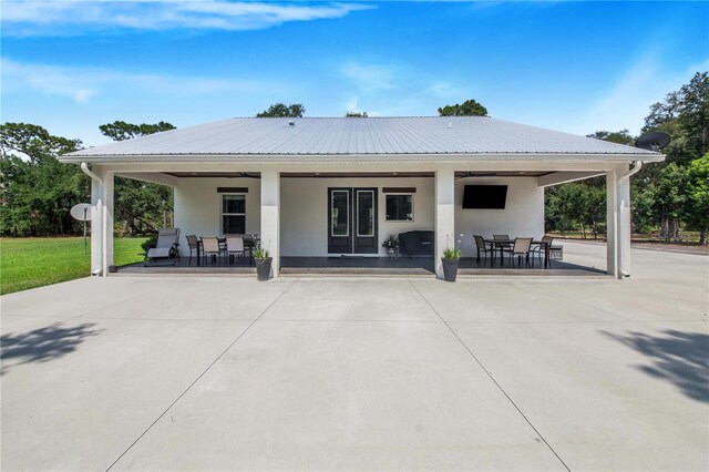 back of house with a patio