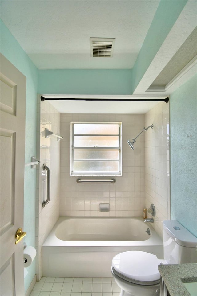 bathroom with toilet, tile patterned floors, visible vents, and shower / bathing tub combination