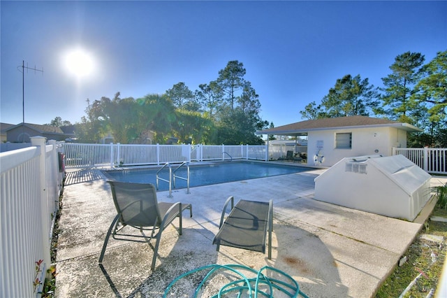 view of pool featuring a fenced backyard, a fenced in pool, and a patio