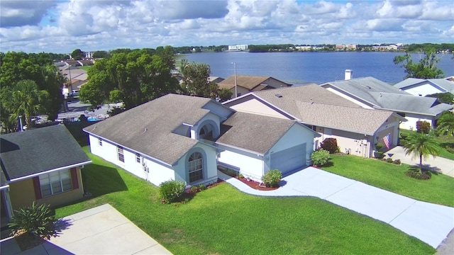 birds eye view of property featuring a residential view and a water view