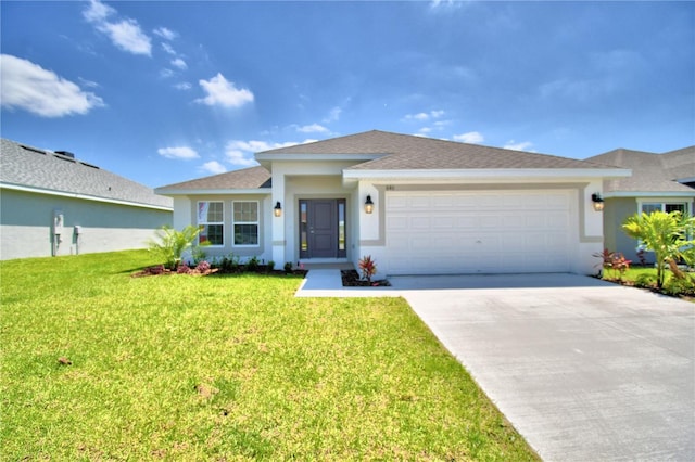 view of front of home featuring a garage and a front lawn