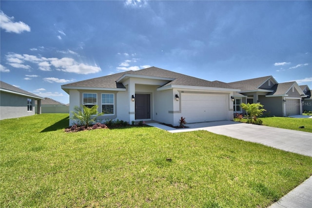 view of front of home featuring a garage and a front lawn