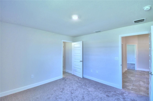 unfurnished bedroom featuring carpet