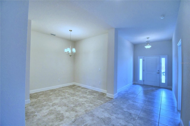 entryway with an inviting chandelier