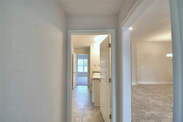 hallway featuring light tile patterned floors