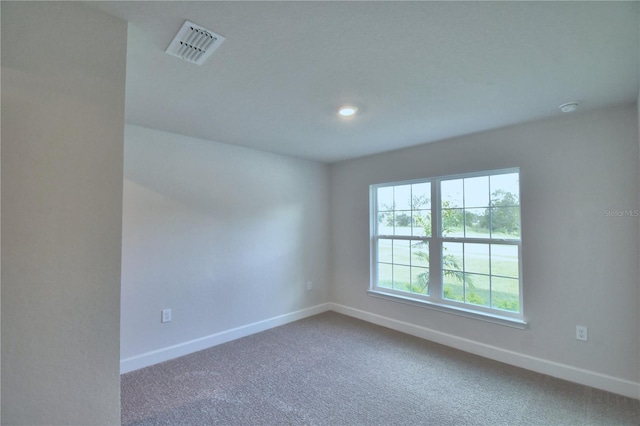 unfurnished room featuring carpet floors