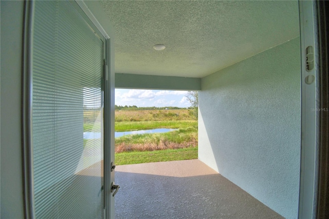 exterior space featuring a textured ceiling