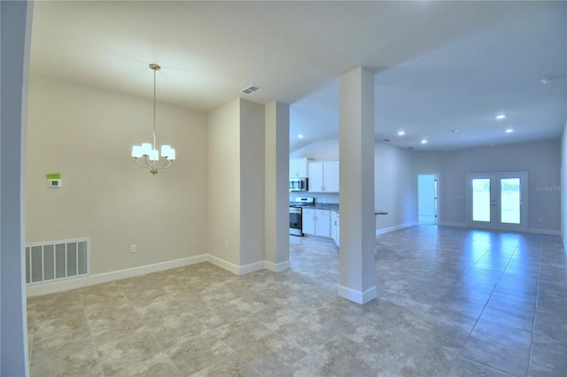 empty room featuring an inviting chandelier