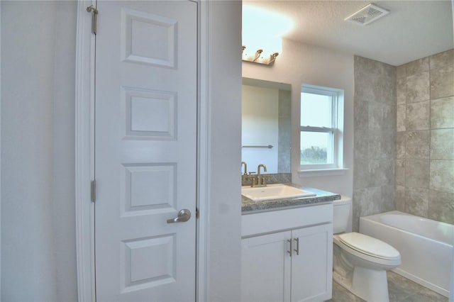 full bathroom featuring vanity, tile patterned floors, toilet, a textured ceiling, and shower / bath combination