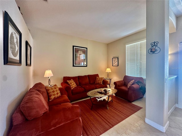 living room with light tile patterned flooring