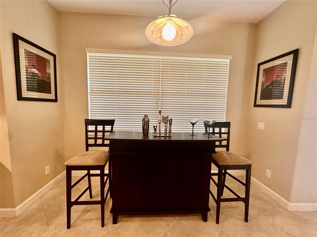 dining area featuring light tile patterned floors