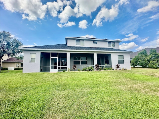 back of house featuring a lawn