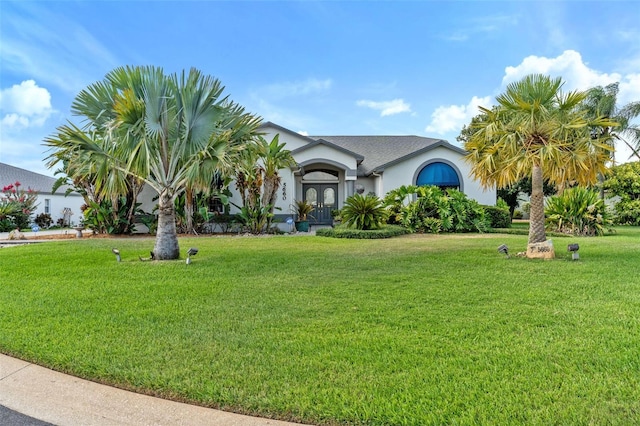 view of front of house with french doors and a front yard