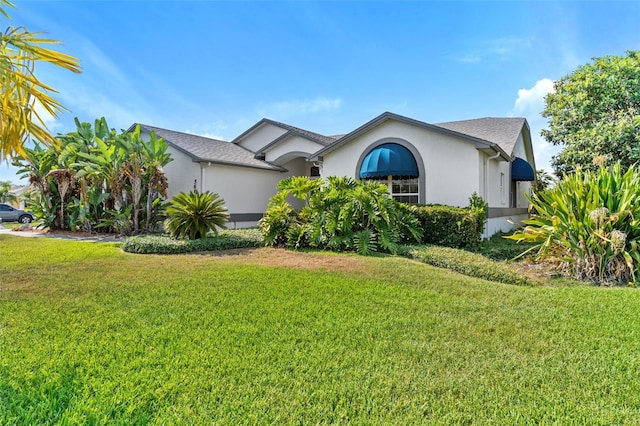 ranch-style house with a front lawn