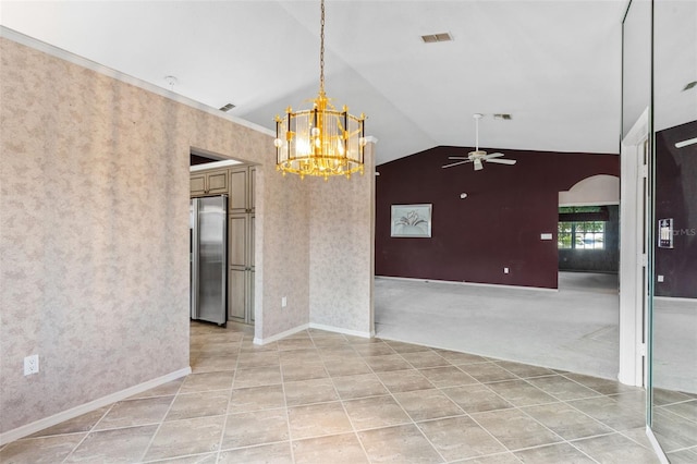 tiled spare room with ceiling fan with notable chandelier and lofted ceiling