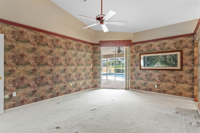 spare room with carpet, ceiling fan, and lofted ceiling