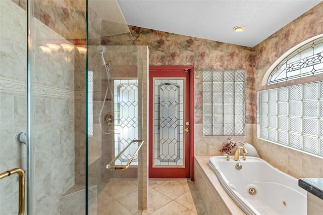 bathroom with tile patterned floors, separate shower and tub, and lofted ceiling