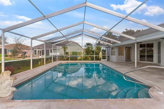 view of pool with a lanai and a patio