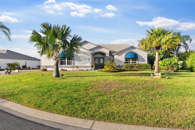 single story home featuring a front yard and french doors