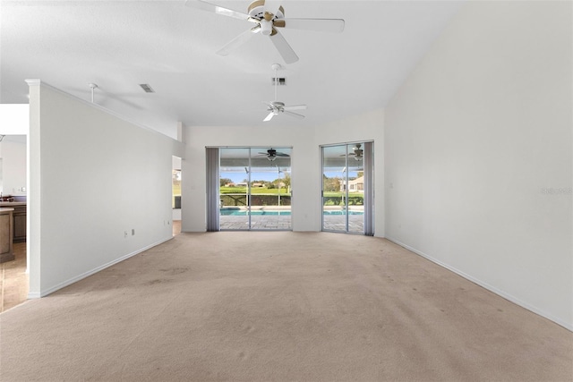 spare room with ceiling fan and light colored carpet