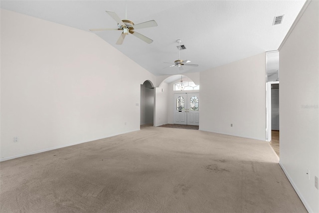 unfurnished living room with light carpet, vaulted ceiling, and ceiling fan