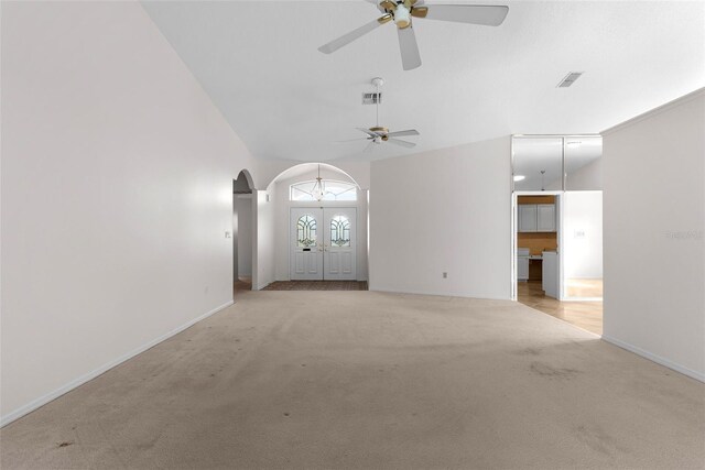 carpeted empty room with ceiling fan and lofted ceiling