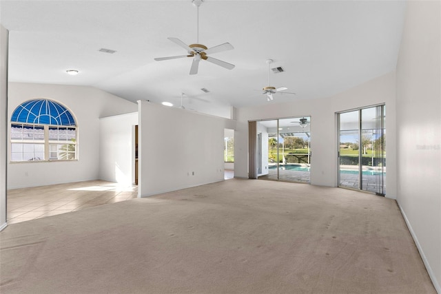 empty room with vaulted ceiling and light carpet