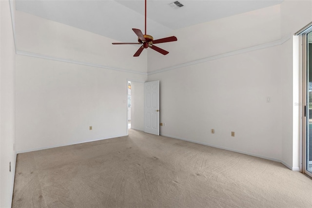 empty room featuring light colored carpet and ceiling fan