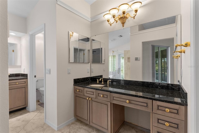 bathroom featuring vanity and toilet