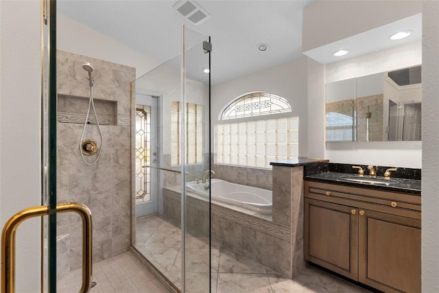 bathroom with vanity and plus walk in shower