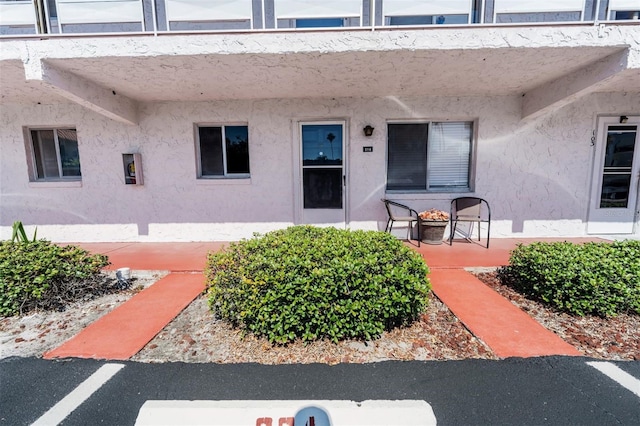 property entrance featuring a patio