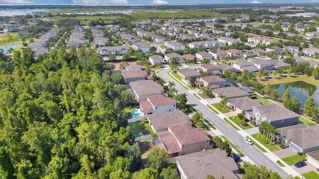 birds eye view of property with a water view