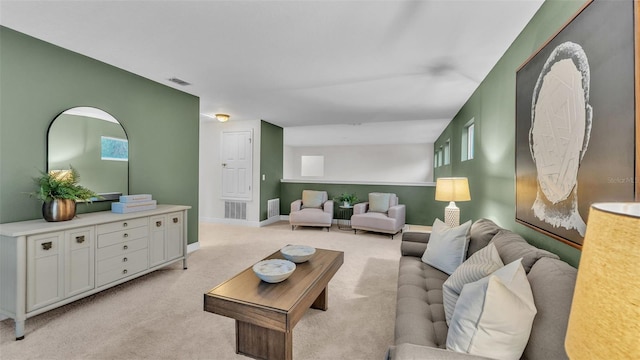 living room featuring a wealth of natural light and light carpet