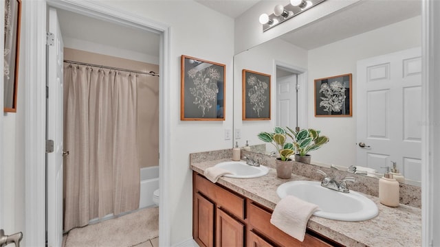 full bathroom featuring tile patterned flooring, vanity, toilet, and shower / tub combo with curtain