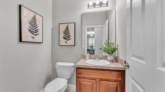 bathroom with vanity and toilet