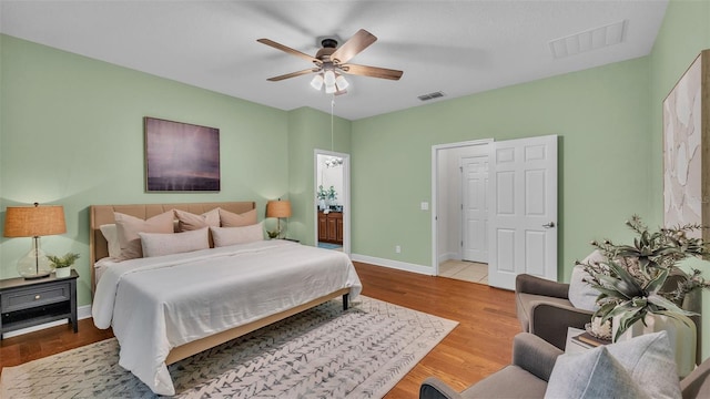 bedroom with light hardwood / wood-style floors and ceiling fan